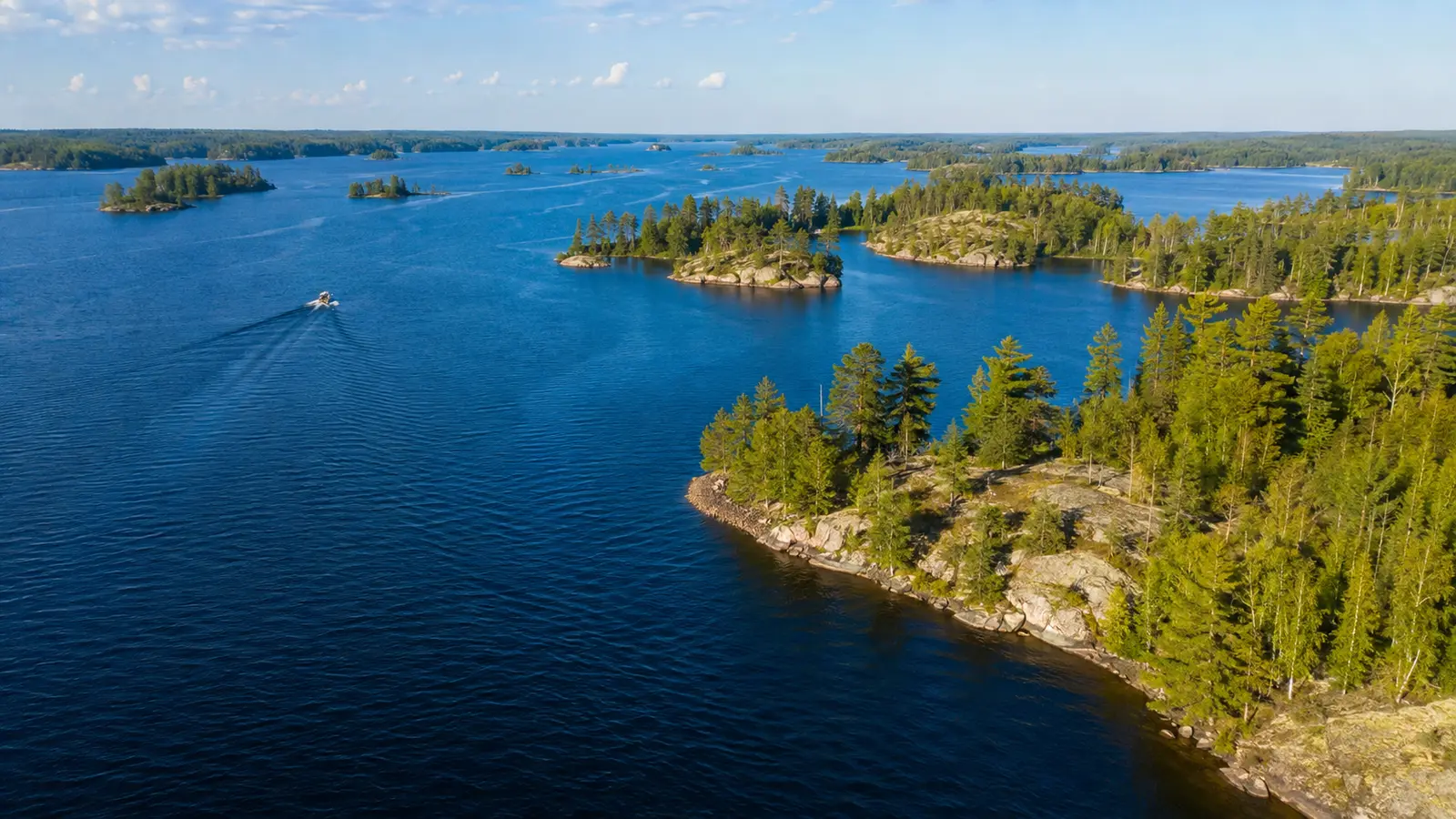 Aerial view of an Ontario lake and forested islands.